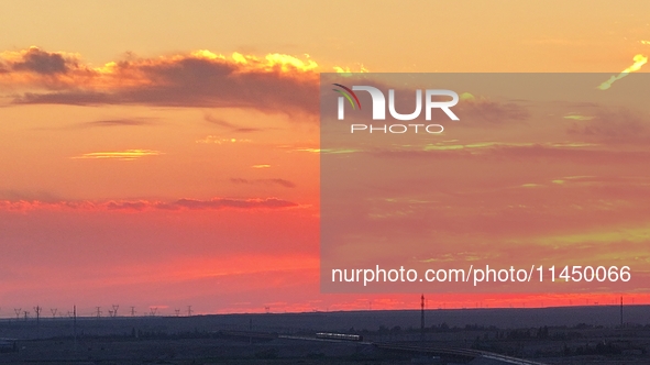 Colorful fire clouds are appearing on the Gobi Beach in Hami, Xinjiang province, China, on August 1, 2024. 