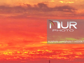 Colorful fire clouds are appearing on the Gobi Beach in Hami, Xinjiang province, China, on August 1, 2024. (