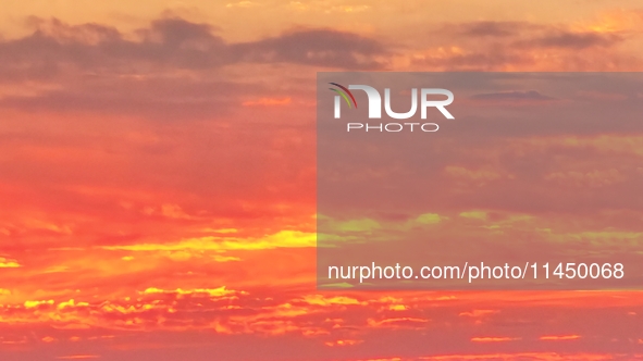 Colorful fire clouds are appearing on the Gobi Beach in Hami, Xinjiang province, China, on August 1, 2024. 