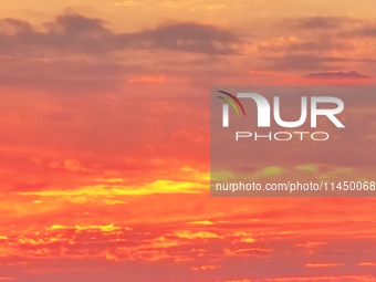 Colorful fire clouds are appearing on the Gobi Beach in Hami, Xinjiang province, China, on August 1, 2024. (