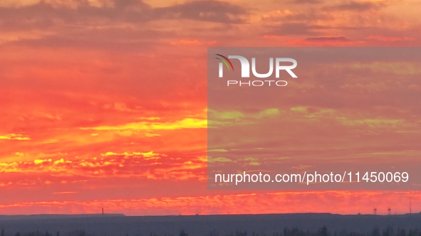 Colorful fire clouds are appearing on the Gobi Beach in Hami, Xinjiang province, China, on August 1, 2024. 