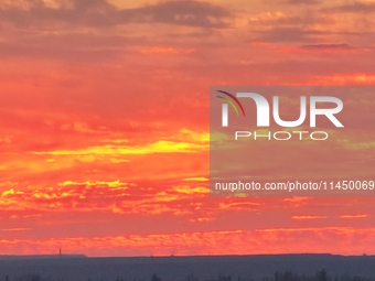 Colorful fire clouds are appearing on the Gobi Beach in Hami, Xinjiang province, China, on August 1, 2024. (