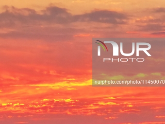 Colorful fire clouds are appearing on the Gobi Beach in Hami, Xinjiang province, China, on August 1, 2024. (