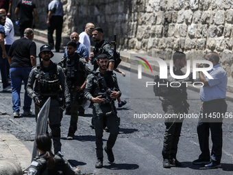 Israeli police forces are preventing Palestinian worshippers from reaching the Al-Aqsa Mosque for Friday prayers, following concerns from th...