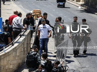 Israeli police forces are preventing Palestinian worshippers from reaching the Al-Aqsa Mosque for Friday prayers, following concerns from th...