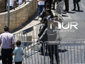 Israeli police forces are preventing Palestinian worshippers from reaching the Al-Aqsa Mosque for Friday prayers, following concerns from th...