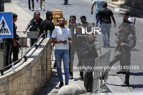 Israeli police forces are preventing Palestinian worshippers from reaching the Al-Aqsa Mosque for Friday prayers, following concerns from th...