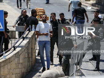 Israeli police forces are preventing Palestinian worshippers from reaching the Al-Aqsa Mosque for Friday prayers, following concerns from th...