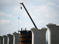 The Nanchang-Jiujiang Intercity Railway Xiu River Super Bridge is under construction in Jiujiang City, Jiangxi province, China, on August 1,...