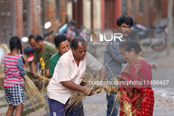 People are preparing to make the effigy of the demon deity Ghantakarna to immolate it, veering off the bad omens and warding off evil spirit...