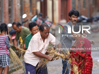 People are preparing to make the effigy of the demon deity Ghantakarna to immolate it, veering off the bad omens and warding off evil spirit...