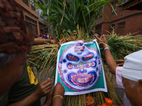 People are preparing the effigy of the demon deity Ghantakarna to immolate it, veering off bad omens and warding off evil spirits in Bhaktap...