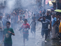 People are dragging the effigy of the demon deity Ghantakarna after setting it on fire to veer off bad omens and ward off evil spirits in Bh...