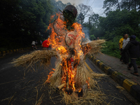 People are setting the effigy of the demon deity Ghantakarna on fire after dragging it down to a crossroad in Bhaktapur, Nepal, on August 2,...