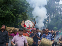 People are dragging the effigy of the demon deity Ghantakarna to set it on fire to veer off bad omens and ward off evil spirits in Bhaktapur...