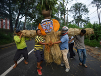 People are dragging the effigy of the demon deity Ghantakarna to set it on fire to veer off bad omens and ward off evil spirits in Bhaktapur...