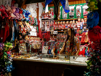 A seller stand in a stall with hand made local souvenirs during a festival of UNESCO enlisted site of historical trade centre in Krakow, Pol...