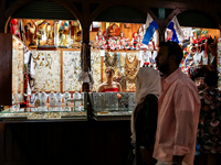 Visitors walk along stalls with hand made local souvenirs during a festival of UNESCO enlisted site of historical trade centre in Krakow, Po...