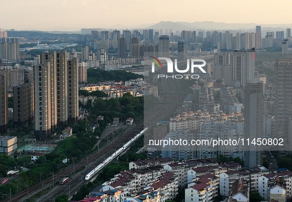 A bullet train is running in Jiujiang, China, on August 1, 2024. 