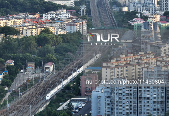 A bullet train is running in Jiujiang, China, on August 1, 2024. 