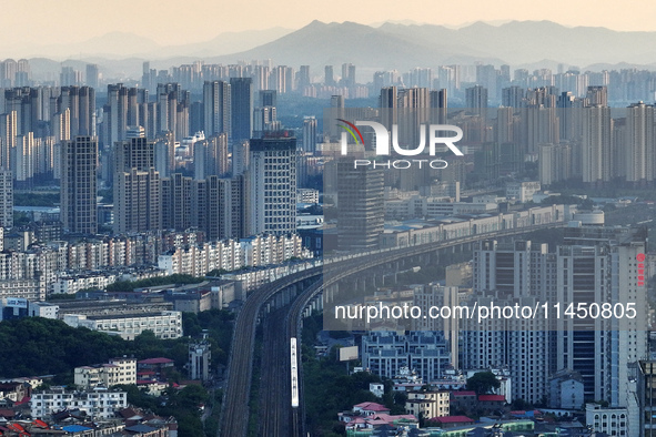 A bullet train is running in Jiujiang, China, on August 1, 2024. 