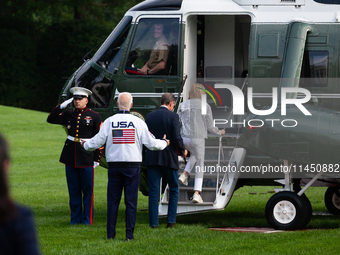 President Joe Biden gestures toward the Marine One pilot as boards with son Hunter Biden and sister Valerie Biden Owens at the White House,...