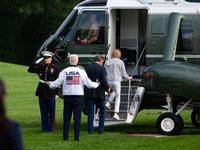 President Joe Biden gestures toward the Marine One pilot as boards with son Hunter Biden and sister Valerie Biden Owens at the White House,...