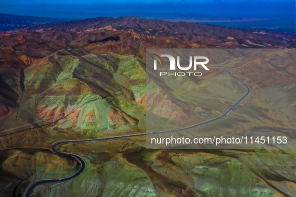 An aerial photo is showing 147 county roads among mountains in Changji Hui Autonomous Prefecture in Xinjiang province, China, on May 3, 2024...