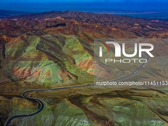 An aerial photo is showing 147 county roads among mountains in Changji Hui Autonomous Prefecture in Xinjiang province, China, on May 3, 2024...