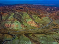 An aerial photo is showing 147 county roads among mountains in Changji Hui Autonomous Prefecture in Xinjiang province, China, on May 3, 2024...