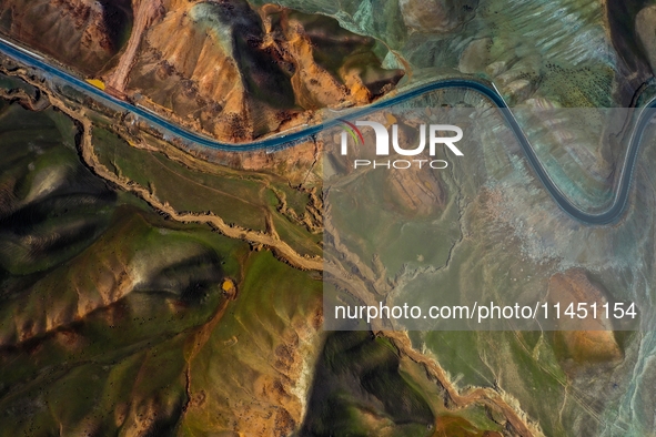 An aerial photo is showing 147 county roads among mountains in Changji Hui Autonomous Prefecture in Xinjiang province, China, on May 3, 2024...