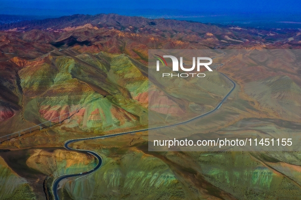 An aerial photo is showing 147 county roads among mountains in Changji Hui Autonomous Prefecture in Xinjiang province, China, on May 3, 2024...