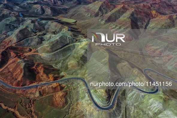 An aerial photo is showing 147 county roads among mountains in Changji Hui Autonomous Prefecture in Xinjiang province, China, on May 3, 2024...