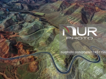 An aerial photo is showing 147 county roads among mountains in Changji Hui Autonomous Prefecture in Xinjiang province, China, on May 3, 2024...