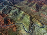 An aerial photo is showing 147 county roads among mountains in Changji Hui Autonomous Prefecture in Xinjiang province, China, on May 3, 2024...