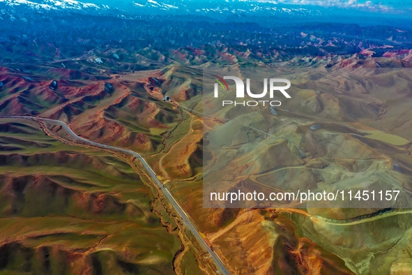 An aerial photo is showing 147 county roads among mountains in Changji Hui Autonomous Prefecture in Xinjiang province, China, on May 3, 2024...