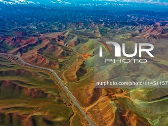 An aerial photo is showing 147 county roads among mountains in Changji Hui Autonomous Prefecture in Xinjiang province, China, on May 3, 2024...