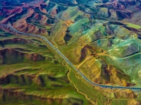 An aerial photo is showing 147 county roads among mountains in Changji Hui Autonomous Prefecture in Xinjiang province, China, on May 3, 2024...