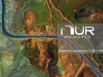 An aerial photo is showing 147 county roads among mountains in Changji Hui Autonomous Prefecture in Xinjiang province, China, on May 3, 2024...