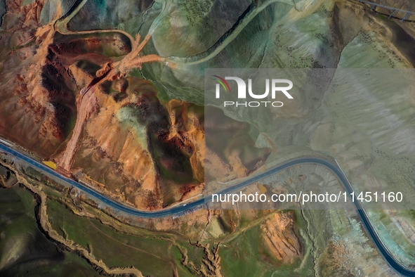 An aerial photo is showing 147 county roads among mountains in Changji Hui Autonomous Prefecture in Xinjiang province, China, on May 3, 2024...