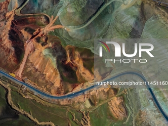 An aerial photo is showing 147 county roads among mountains in Changji Hui Autonomous Prefecture in Xinjiang province, China, on May 3, 2024...