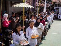 The Cireundeu Indigenous people are taking part in the Ngemban Taun traditional ceremony in Cireundeu Village, West Java, Indonesia, on Augu...