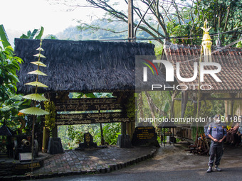 A man is standing guard during the Ngemban Taun traditional ceremony in Cireundeu Village, West Java, Indonesia, on August 3, 2024. Ngemban...