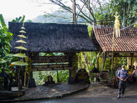 A man is standing guard during the Ngemban Taun traditional ceremony in Cireundeu Village, West Java, Indonesia, on August 3, 2024. Ngemban...