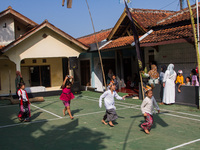 Children are playing during the Ngemban Taun traditional ceremony in Cireundeu Village, West Java, Indonesia, on August 3, 2024. Ngemban Tau...