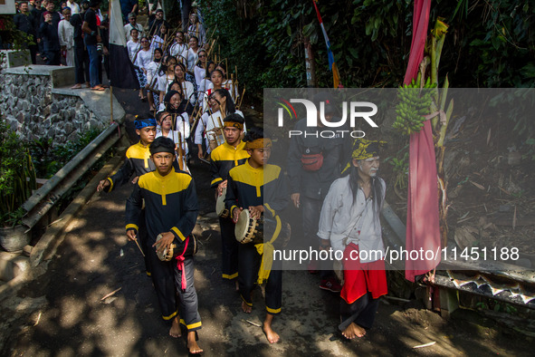 The Cireundeu Indigenous people are taking part in the Ngemban Taun traditional ceremony in Cireundeu Village, West Java, Indonesia, on Augu...