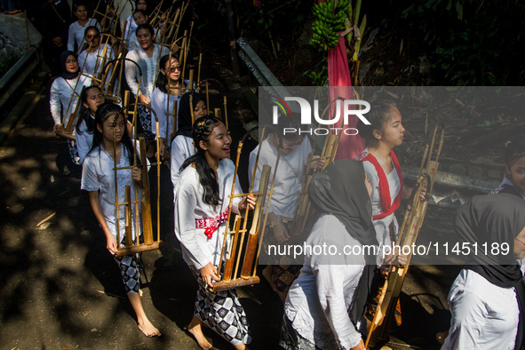 The Cireundeu Indigenous people are taking part in the Ngemban Taun traditional ceremony in Cireundeu Village, West Java, Indonesia, on Augu...