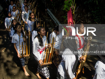 The Cireundeu Indigenous people are taking part in the Ngemban Taun traditional ceremony in Cireundeu Village, West Java, Indonesia, on Augu...