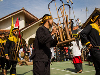 The Cireundeu Indigenous people are performing Angklung Buncis during the Ngemban Taun traditional ceremony in Cireundeu Village, West Java,...