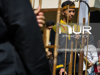 The Cireundeu Indigenous people are performing Angklung Buncis during the Ngemban Taun traditional ceremony in Cireundeu Village, West Java,...